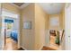 Hallway showcasing hardwood floors, neutral paint, and views into adjacent rooms, creating a warm and connected living space at 2020 Port Royal Rd, Raleigh, NC 27609