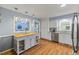Open kitchen with a central island, stainless steel dishwasher, and sleek countertops at 2020 Port Royal Rd, Raleigh, NC 27609