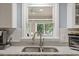 Kitchen sink features a window providing natural light and views of the outdoors at 2020 Port Royal Rd, Raleigh, NC 27609