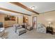 Inviting living room features exposed beam ceiling, neutral decor, and comfortable seating arrangement at 2020 Port Royal Rd, Raleigh, NC 27609
