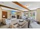 Cozy living room includes neutral decor, fireplace and an exposed beam ceiling at 2020 Port Royal Rd, Raleigh, NC 27609