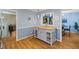 Open living room featuring a kitchen island and hardwood floors throughout the room at 2020 Port Royal Rd, Raleigh, NC 27609