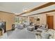 Bright living room boasts a bay window, neutral decor and exposed beam ceiling at 2020 Port Royal Rd, Raleigh, NC 27609
