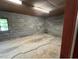 Unfinished basement featuring a window and unfinished walls and floors at 2022 Bivins St, Durham, NC 27707