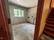 Unfinished basement area showing concrete floor and access to stairs at 2022 Bivins St, Durham, NC 27707