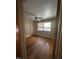 Bedroom featuring neutral walls, ceiling fan, window with blinds, and wood flooring at 2022 Bivins St, Durham, NC 27707