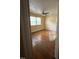 Bedroom features ceiling fan, wood floors, neutral walls, and large windows with blinds at 2022 Bivins St, Durham, NC 27707