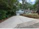 Charming two-story home with a stone facade, large driveway, and a well-maintained lawn at 2022 Bivins St, Durham, NC 27707