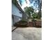 Exterior view of a home with a stone facade, brick steps, and established landscaping at 2022 Bivins St, Durham, NC 27707