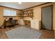 Home office featuring built-in shelves and cabinets, a window, and a desk space at 2022 Bivins St, Durham, NC 27707