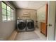 Functional laundry area with washer, dryer, window and storage at 2022 Bivins St, Durham, NC 27707