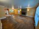 Spacious living room featuring hardwood floors, a stone fireplace, and ample natural light at 2022 Bivins St, Durham, NC 27707