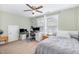 Bedroom with twin bed featuring two computer workstations and an overhead ceiling fan at 210 Olde Liberty Dr, Youngsville, NC 27596