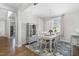 Charming dining room features a chandelier, hardwood floors, and decorative cabinet at 210 Olde Liberty Dr, Youngsville, NC 27596