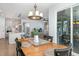Open-concept dining area with views into the kitchen and living room, perfect for entertaining at 210 Olde Liberty Dr, Youngsville, NC 27596