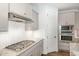 Modern kitchen features stainless steel appliances, granite countertops, and white subway tile backsplash at 210 Olde Liberty Dr, Youngsville, NC 27596