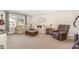 Comfortable living area features a mix of sofas, an ottoman, and a plush recliner at 210 Olde Liberty Dr, Youngsville, NC 27596