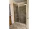 Bathroom featuring a glass-enclosed shower with built-in bench seating at 211 Hillcrest Dr, Oxford, NC 27565