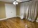 Bedroom with hardwood floors, neutral paint, a ceiling fan, and double door closet at 211 Hillcrest Dr, Oxford, NC 27565