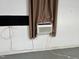 Garage showcasing an air conditioning unit with a curtain for added efficiency and privacy at 211 Hillcrest Dr, Oxford, NC 27565