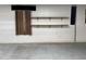 Open garage space with natural light, showcasing shelving and ample room for storage and projects at 211 Hillcrest Dr, Oxford, NC 27565