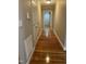 Hallway featuring hardwood floors and access to other rooms at 211 Hillcrest Dr, Oxford, NC 27565