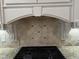 Close up of kitchen featuring granite countertops and a decorative tile backsplash at 211 Hillcrest Dr, Oxford, NC 27565