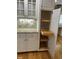 Kitchen featuring white cabinets and drawers, granite countertops, and a pull out wooden spice rack at 211 Hillcrest Dr, Oxford, NC 27565