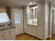 Kitchen featuring white cabinets and drawers, stainless steel appliances, and a glass door at 211 Hillcrest Dr, Oxford, NC 27565