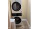 Convenient laundry room with a stacked washer and dryer at 211 Hillcrest Dr, Oxford, NC 27565