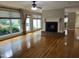 Inviting living room with a fireplace, large windows, and hardwood floors that create a warm atmosphere at 211 Hillcrest Dr, Oxford, NC 27565