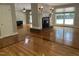 Open-concept living area with a charming fireplace, hardwood floors, and abundant natural light at 211 Hillcrest Dr, Oxford, NC 27565