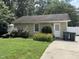 Exterior view of the outbuilding with tidy landscaping at 211 Hillcrest Dr, Oxford, NC 27565