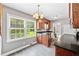Charming kitchen featuring dark countertops, wood cabinets, and a bright, airy atmosphere at 306 Mitchell Ave, Franklinton, NC 27525