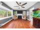 Bright living room boasts hardwood floors, a cozy fireplace, and large windows at 306 Mitchell Ave, Franklinton, NC 27525