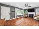 Hardwood floors, a cozy fireplace, and large windows define this traditional living room at 306 Mitchell Ave, Franklinton, NC 27525