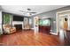 Inviting living room features hardwood floors, a fireplace, and unique aquarium at 306 Mitchell Ave, Franklinton, NC 27525