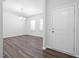 Bright dining area with hardwood floors and a chandelier, ideal for Gathering gatherings at 3219 Pelican Ln, Durham, NC 27703