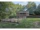 Spacious fenced in backyard featuring a brick home and beautiful landscaping at 3863 Avents Ferry Rd, Sanford, NC 27330