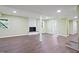 Finished basement with a brick fireplace and hardwood floors at 3863 Avents Ferry Rd, Sanford, NC 27330