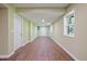Unfinished basement space with wood-look flooring, neutral paint, and natural light from the window at 3863 Avents Ferry Rd, Sanford, NC 27330