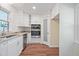 Updated kitchen featuring white cabinets, granite countertops, and stainless steel appliances at 3863 Avents Ferry Rd, Sanford, NC 27330