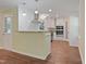 Updated kitchen featuring white cabinets, granite countertops, and stainless steel appliances at 3863 Avents Ferry Rd, Sanford, NC 27330