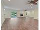 Inviting living room with wood floors, fan, fireplace, and sliding doors to the outside at 3863 Avents Ferry Rd, Sanford, NC 27330