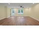 Bright living room with wood floors, ceiling fan and ample natural light at 3863 Avents Ferry Rd, Sanford, NC 27330