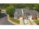 Birds-eye view of townhomes featuring mature trees, well-maintained landscaping, and individual driveways at 428 Grand Pointe Dr, Garner, NC 27529