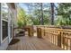 Wooden deck in backyard surrounded by trees, a wood fence, and siding at 428 Grand Pointe Dr, Garner, NC 27529