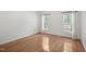Bedroom with hardwood floors, white paint, two windows and white trim and molding at 428 Grand Pointe Dr, Garner, NC 27529