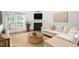 Cozy living room with neutral decor, a fireplace, and access to the outdoors at 428 Grand Pointe Dr, Garner, NC 27529
