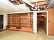 Unfinished basement with wood paneling and built-in shelving at 4324 Garland Dr, Raleigh, NC 27606